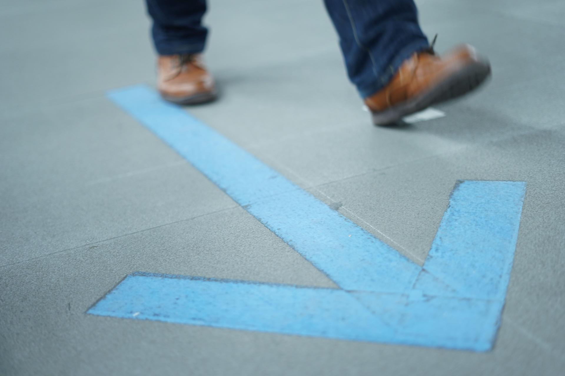 Walk toward the arrow.